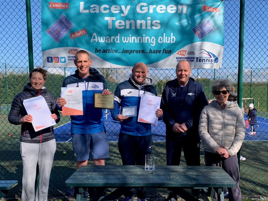A team of five staff at Lacey Gen and Loosely Row Tennis Club, stood holding certificates 