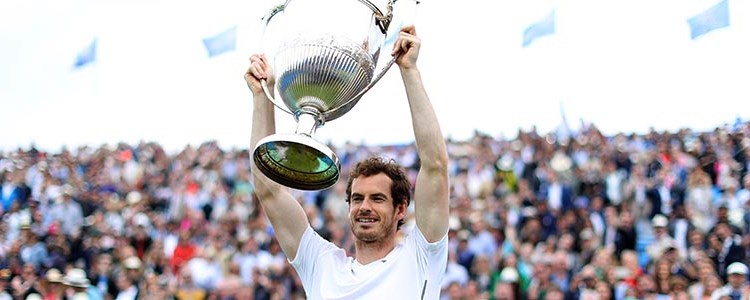 Andy Murray lifting a trophy after winning the men's final at Queens in 2016
