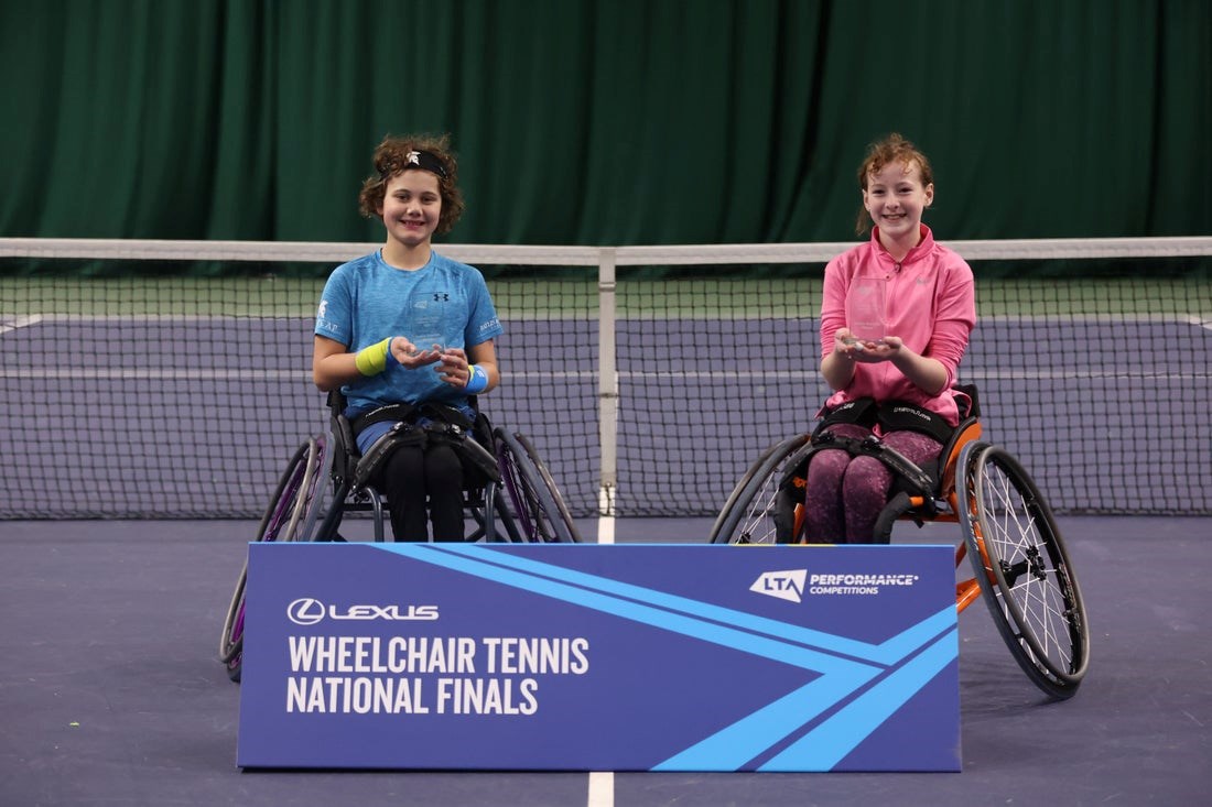 The finalist and runner up posing with their trophies at the wheelchair tennis national finals.
