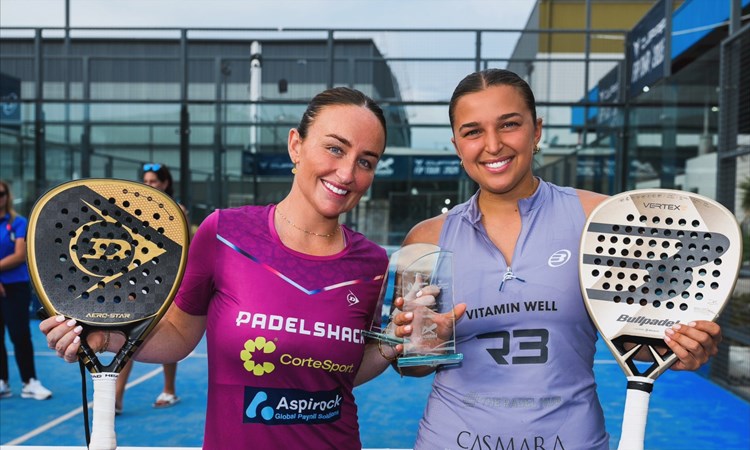 British Padel players Aimee Gibson and Catherine Rose smiling while holding their padel rackets and the FIP Silver Australian Padel Open trophy