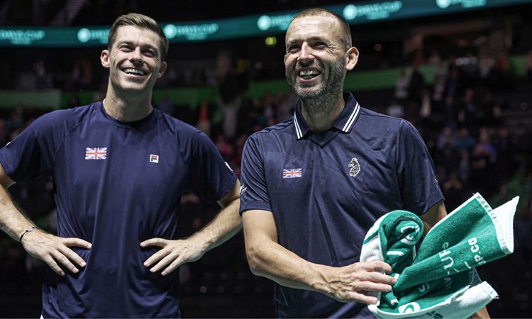 Davis Cup stars Neal Skupski and Dan Evans smiling on court