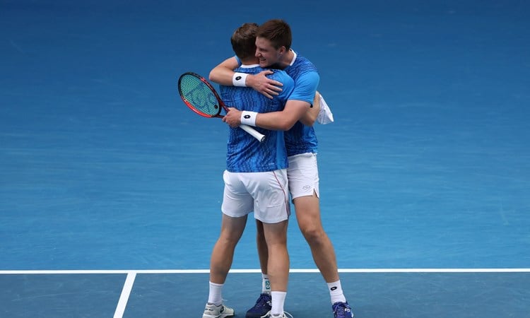 Henry Patten and Harri Heliovaara hug after winning in the Australian Open semi-final