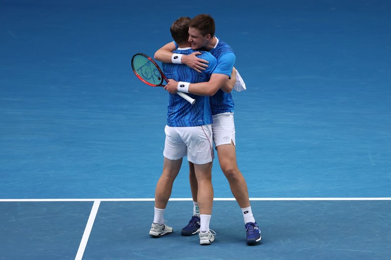 Henry Patten and Harri Heliovaara hug after winning in the Australian Open semi-final