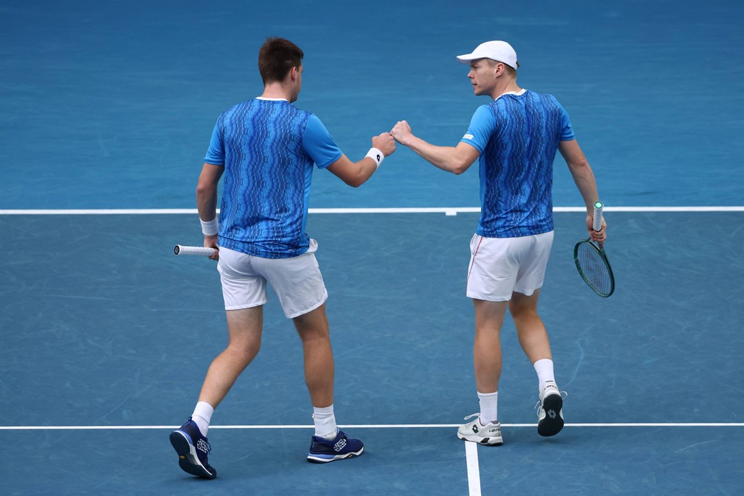 Henry Patten and Harri Heliovaara fist bumping during the Australian Open semi-final