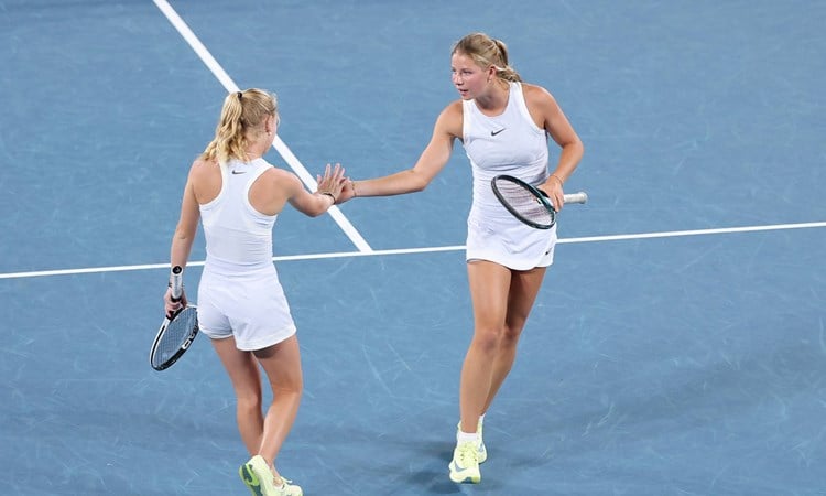 Hannah Klugman and Emerson Jones high five during the Australian Open semi-final