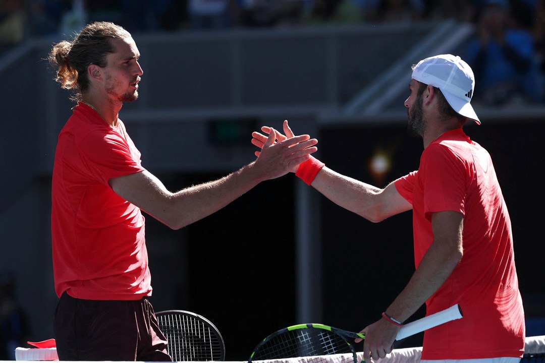 British tennis player Jacob Fearnley shaking hands with Alexander Zverev at the 2025 Australian Open