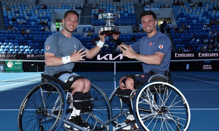 Alfie Hewett and Gordon Reid holding the 2025 Australian Open men's wheelchair doubles title