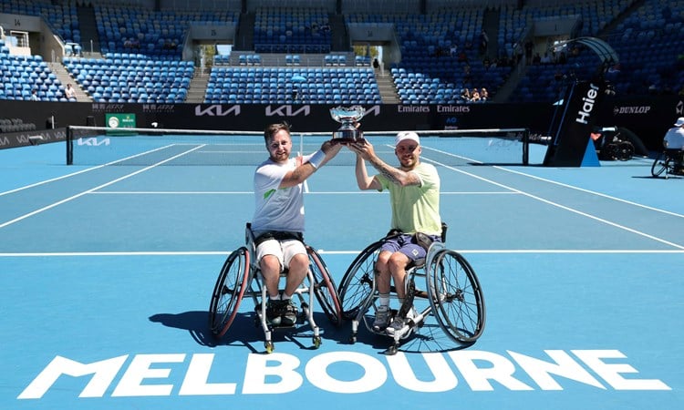 Sam Chroder and Andy Lapthorne holding the 2025 Australian Open quad doubles title