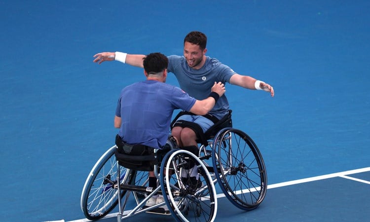 Alfie Hewett and Gordon Reid hug after wining their sixth successive Australian Open doubles title in 2025