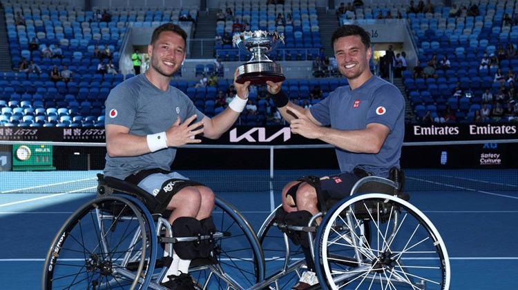 Alfie Hewett and Gordon Reid holding the 2025 Australian Open men's wheelchair doubles title