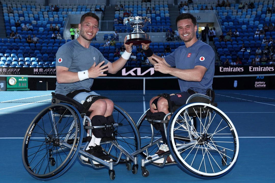 Alfie Hewett and Gordon Reid holding the 2025 Australian Open men's wheelchair doubles title