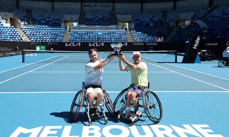 Sam Chroder and Andy Lapthorne holding the 2025 Australian Open quad doubles title