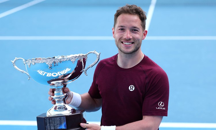 Alfie Hewett holding the 2025 Australian Open men's singles title