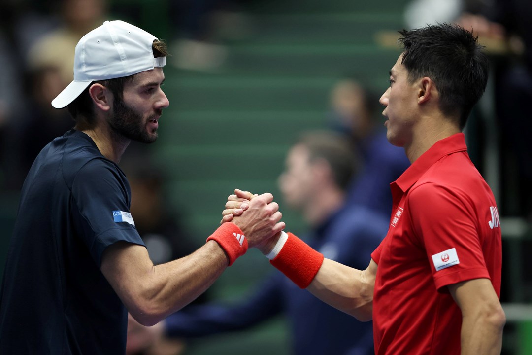 Jacob Fearnley and Kei Nishikori shake hands at the Davis Cup