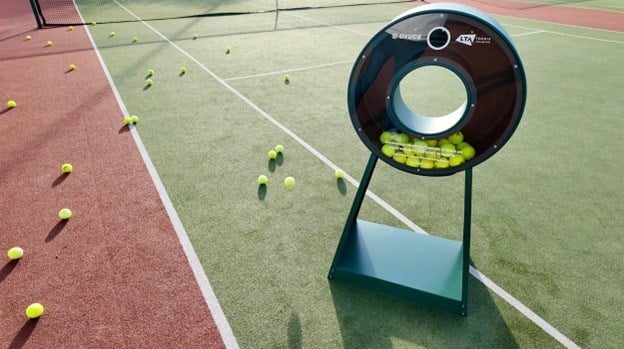 A dyuce tennis ball recycling unit on court