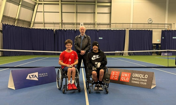 Greg Slade holding the doubles runner-up trophy at the Bolton Indoor ITF 2