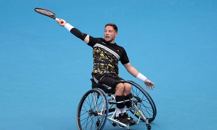 Great Britain's Alfie Hewett hitting a backhand on court in his wheelchair at the 2024 Australian Open