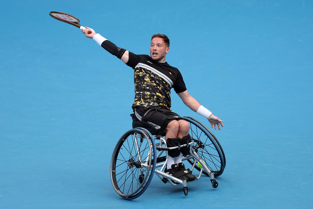 Great Britain's Alfie Hewett hitting a backhand on court in his wheelchair at the 2024 Australian Open