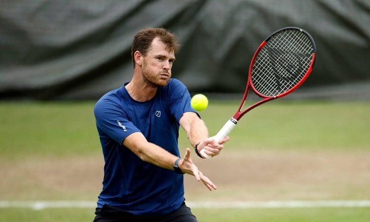 Jamie Murray hitting a volley during training at Wimbledon