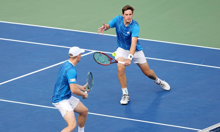 Henry Patten stretching for a volley at the Dubai Duty Free Tennis Championships