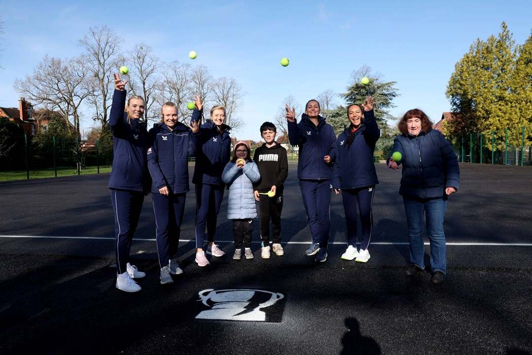 Billie Jean King Cup squad painting a park tennis court at Spencer Park, Coventry