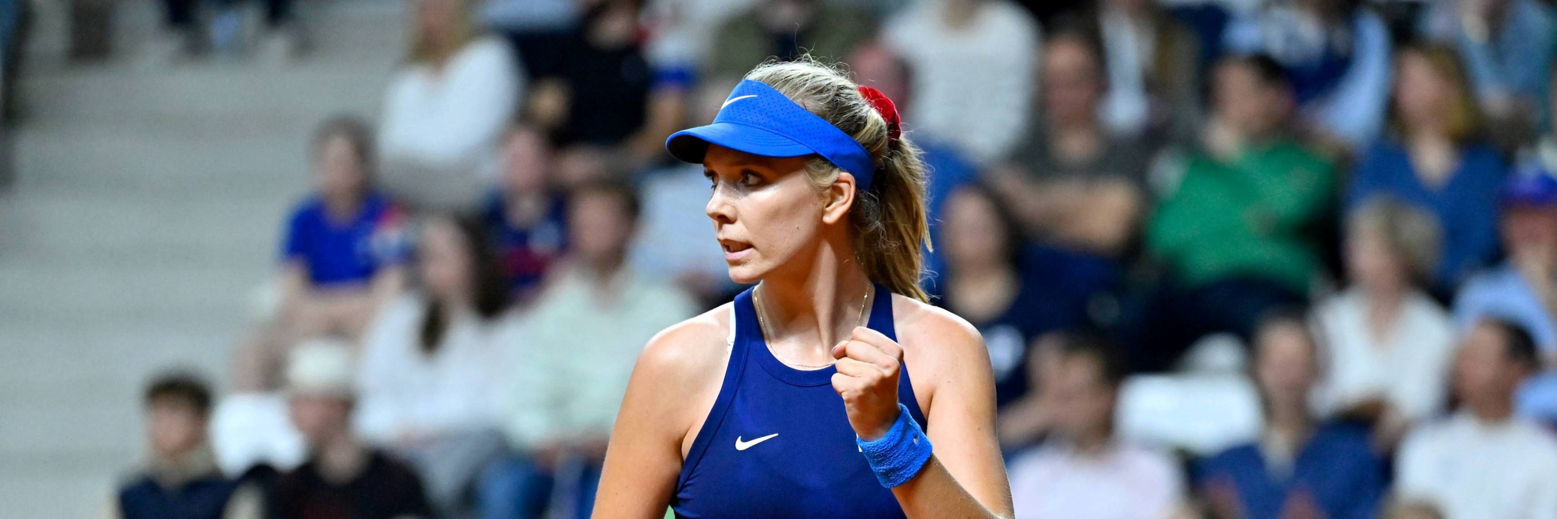 Katie Boulter celebrates winning a point against Clara Burel at the Billie Jean King Cup 