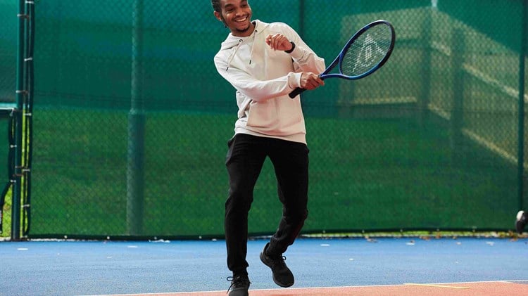A male tennis player on court at the National Tennis Centre for the Tennis Black List event