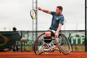 Alfie Hewett hits a backhand in the final of the World Team Cup 2024