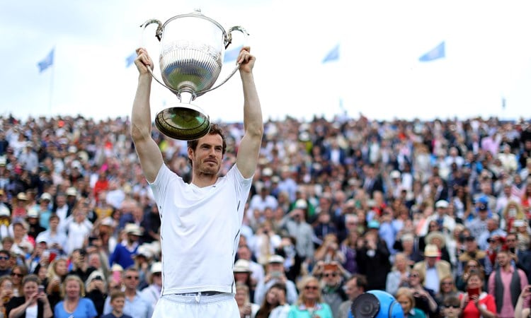 Andy Murray lifts the trophy after being crowned champion of the Queen's Championships in 2016