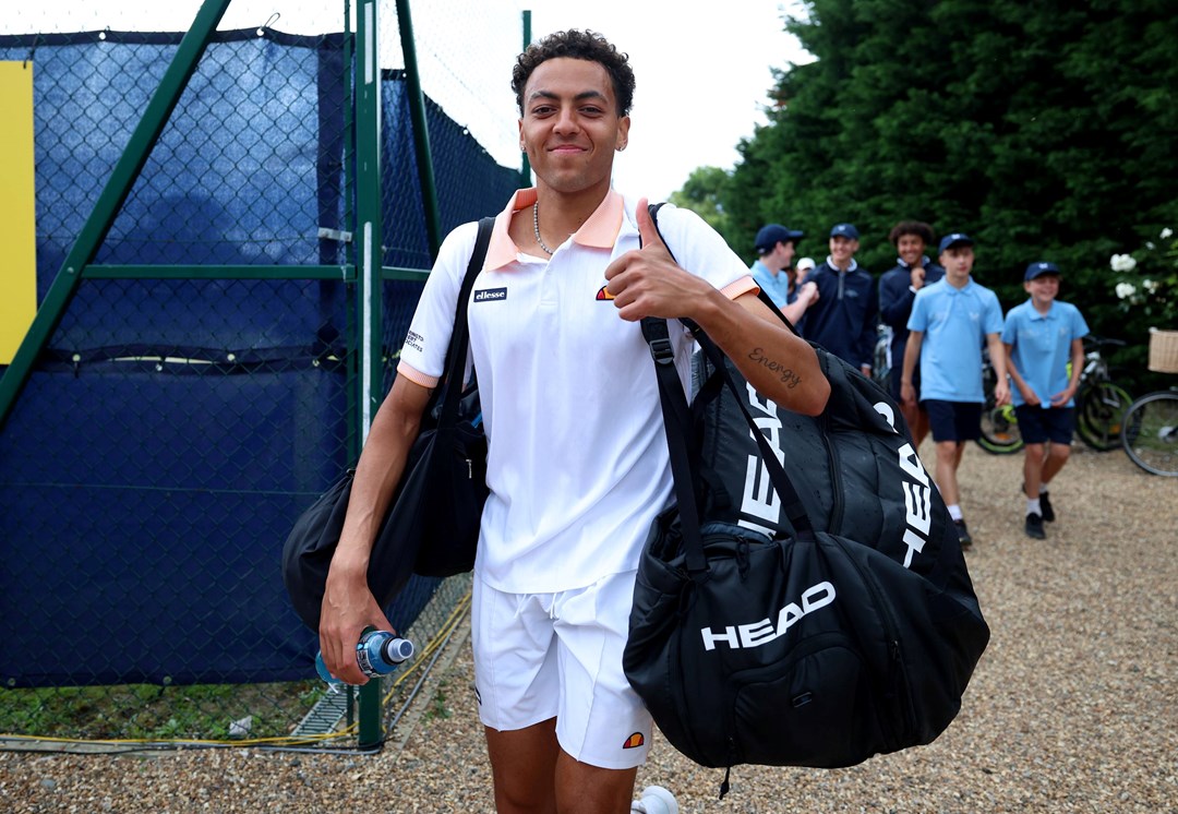 Paul Jubb smiles and gives a thumbs up to the cameras after a first round with at Lexus Surbiton Trophy