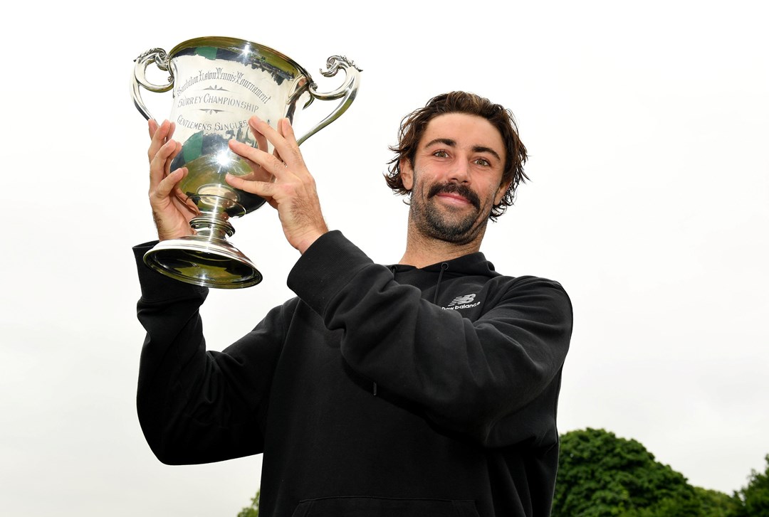 Jordan Thompson holding the Surbiton Trophy