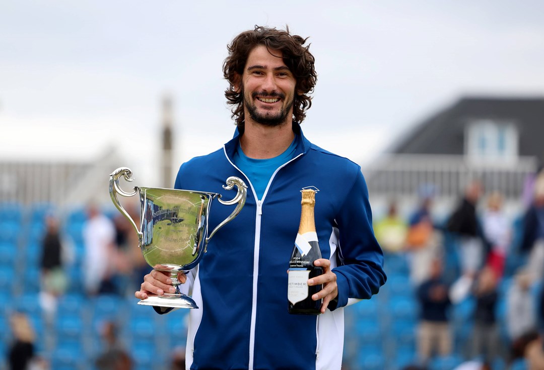 Lloyd Harris holding the Lexus Surbiton Trophy title