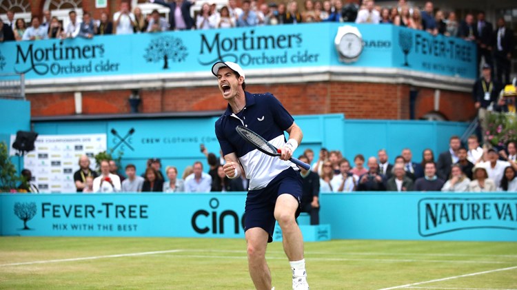 Andy Murray celebrates winning the doubles at the 2019 Queen's Club Championships