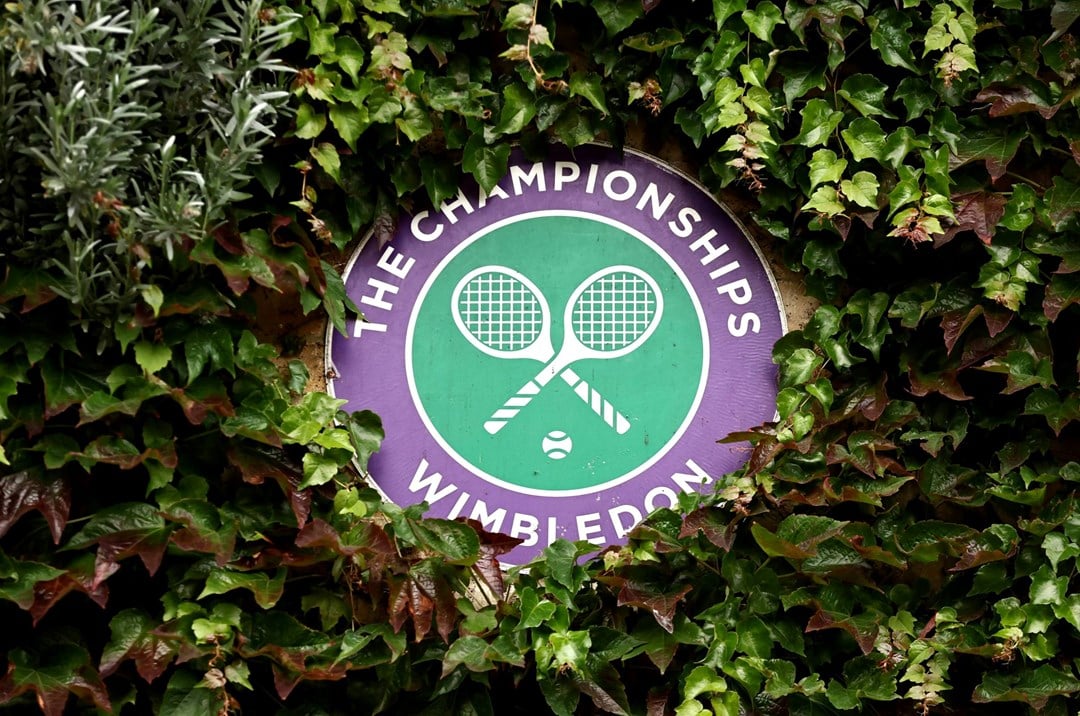 Wimbledon logo decoratively placed in a bush