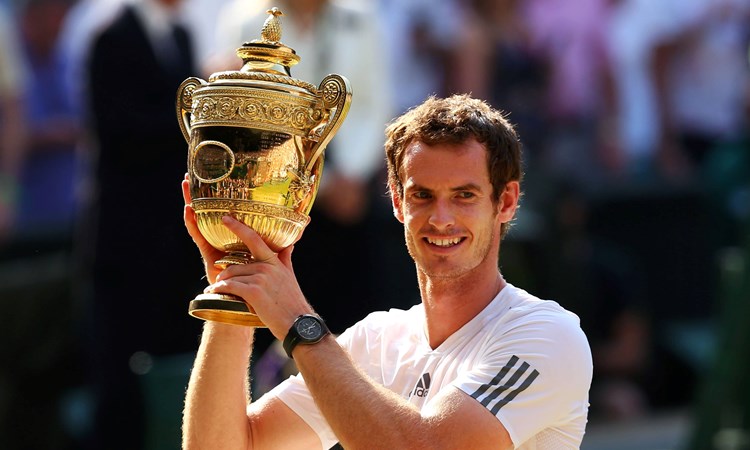 Andy Murray holding his first Wimbledon title in 2013