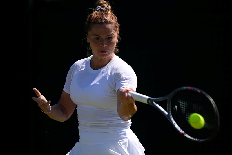 Sarah Beth Grey returning forehand during her qualifying match against Lulu Sun at the 2022 Wimbledon Championships