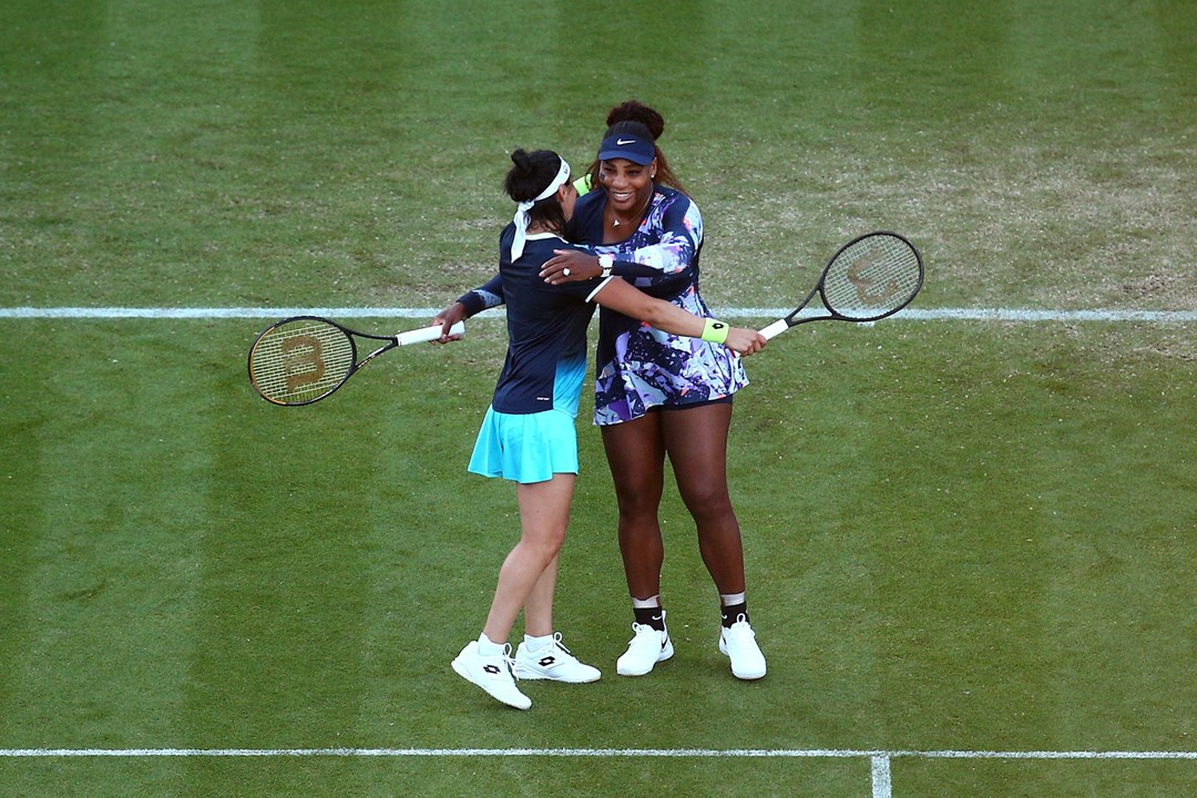 Serena Williams and Ons Jabeur embracing after winning their second round match at the Rothesay International Eastbourne