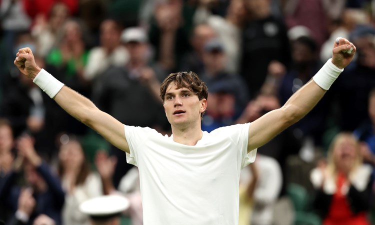 Jack Draper celebrates a five set win in the first round of Wimbledon against Elias Ymer