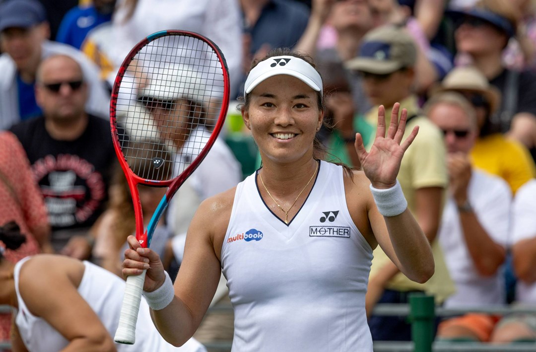 Lily Miyazaki waves to the camera after winning the first round of Wimbledon qualifiers