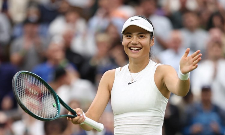 Emma Raducanu smiles to the crowd after beating Maria Sakkari in teh third round at Wimbledon