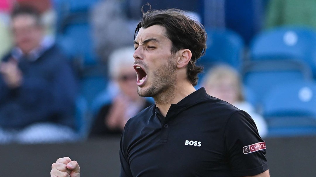 Taylor Fritz screaming while clenching his fist on court at the Rothesay International Eastbourne