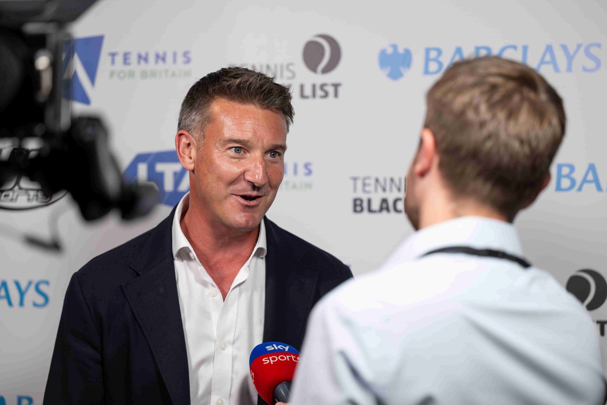 LTA CEO Scott Lloyd talking to a presenter at Sky Sports at the Tennis Black List awards