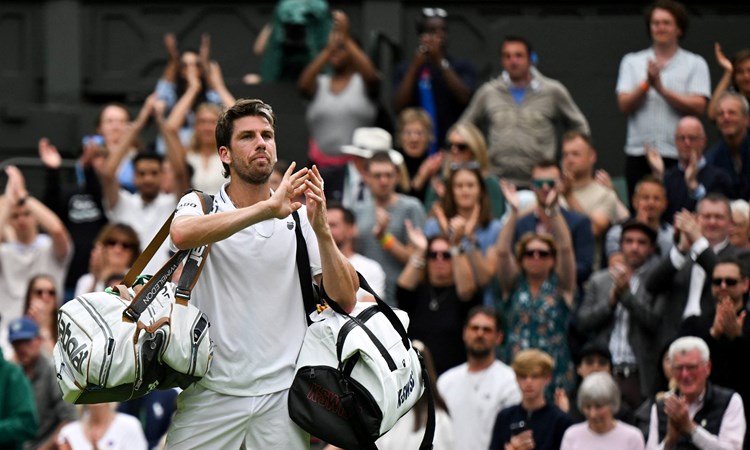 Cam Norrie claps the crowd as he exits Centre Court after losig in the third round of Wimbledon