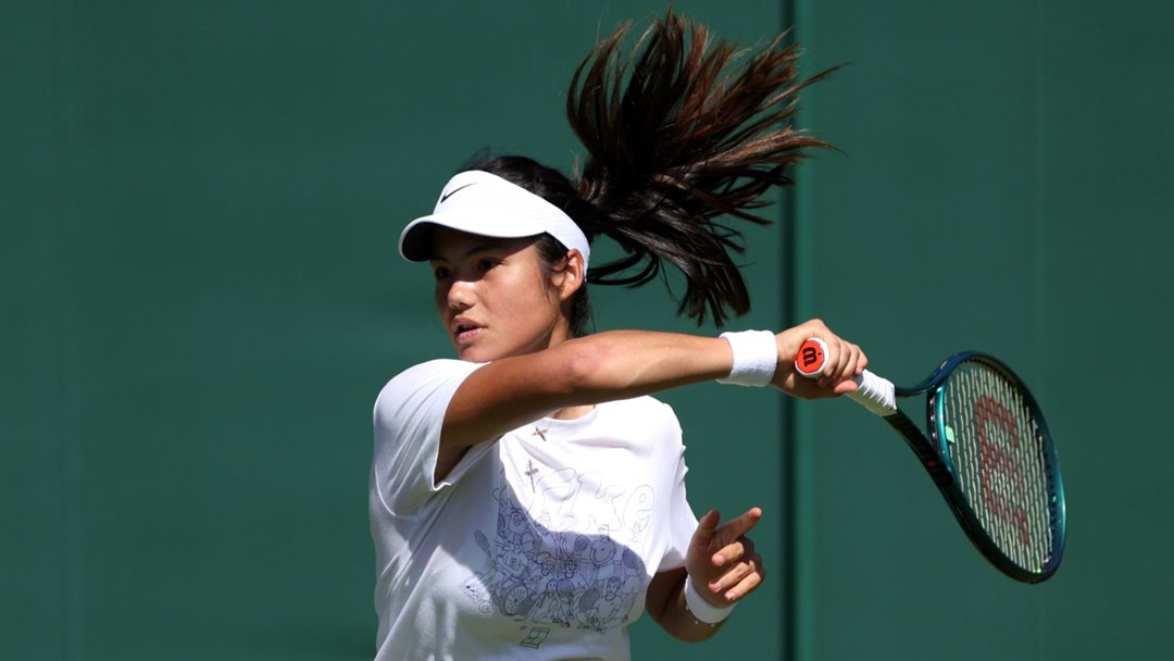 Emma Raducanu hitting a forehand on court at Wimbledon