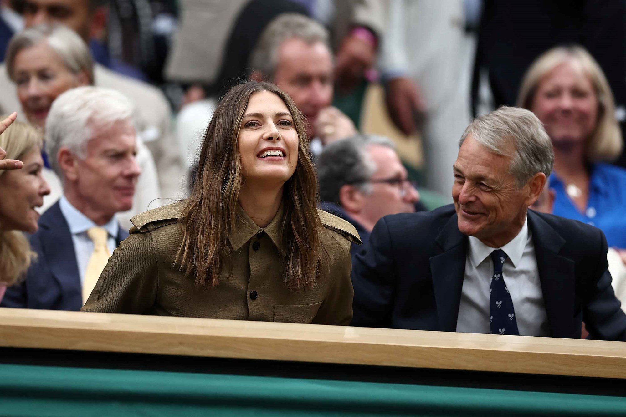 Maria Sharapova laughing and smiling in the Royal Box at Wimbledon