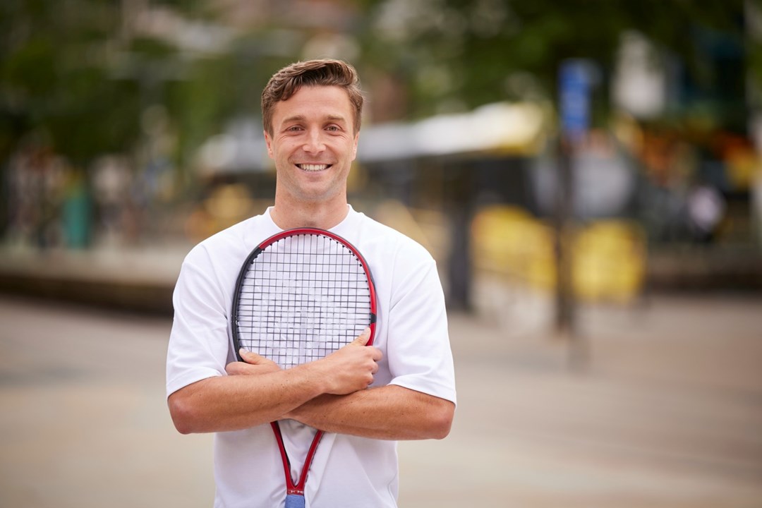 Liam Broady standing in Manchester city centre to promote the Davis Cup Finals at the Manchester AO Arena