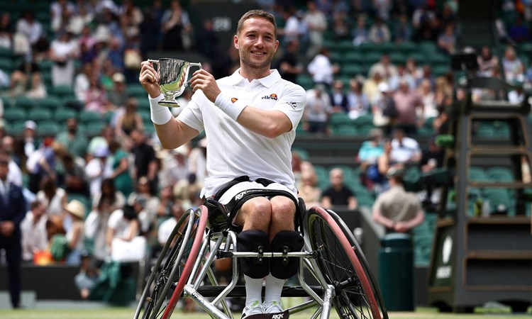 Alfie Hewett holding the Wimbledon men's wheelchair singles title