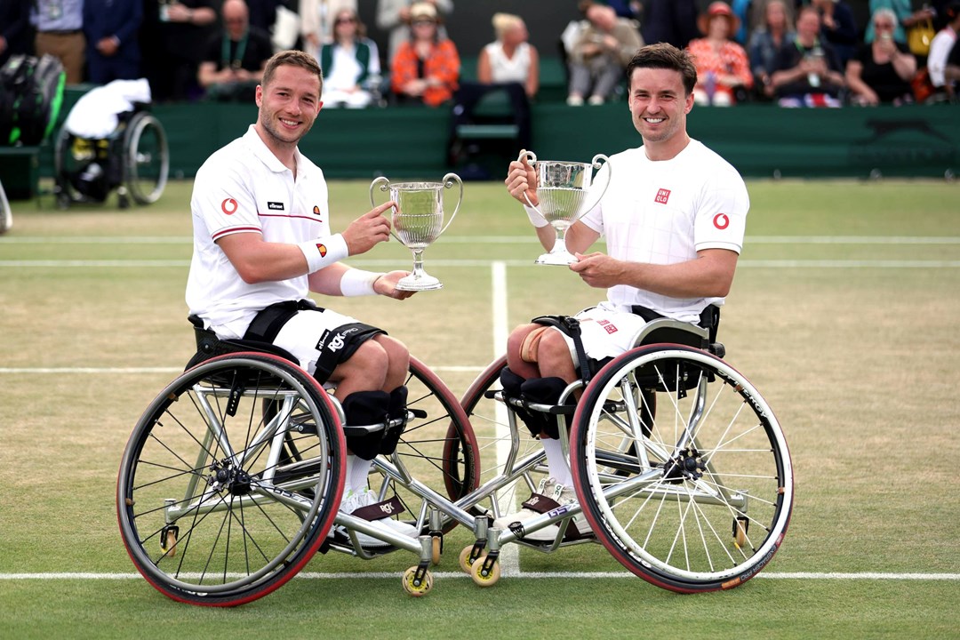 Alfie Hewett and Gordon Reid holding their sixth Wimbledon doubles title