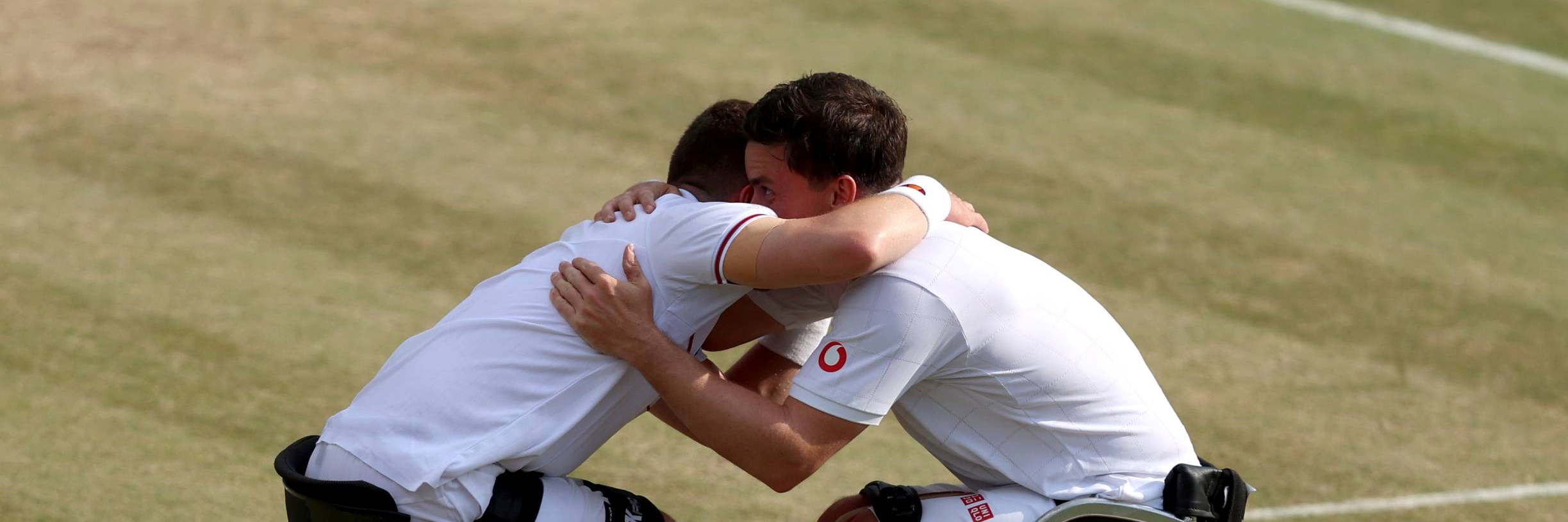 Alfie Hewett and Gordon Reid hug after winning a sixth Wimbledon title