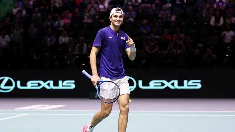 Jack Draper points to the crowd after winning his first Davis Cup match in Manchester